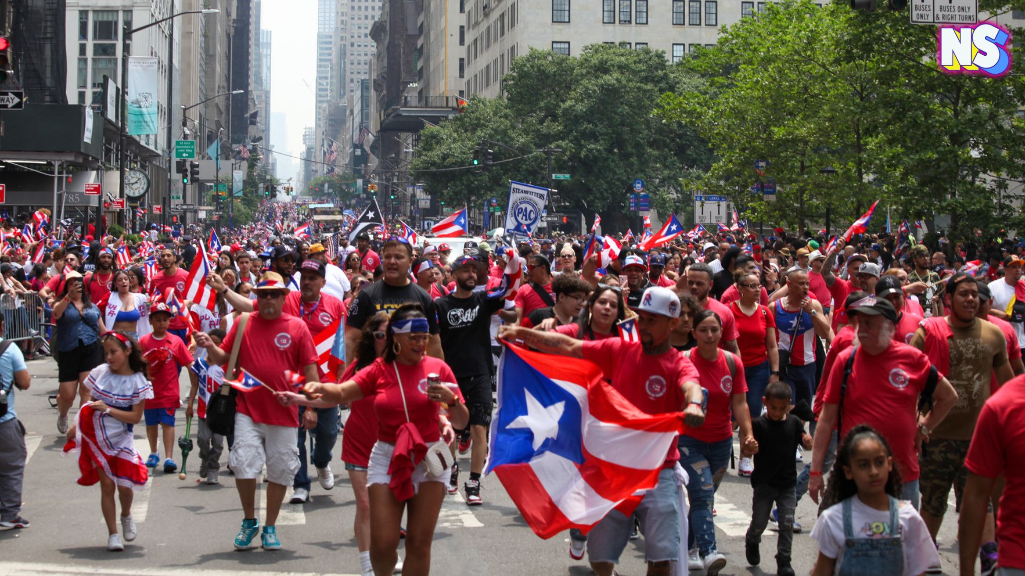 Feature image: National Puerto Rican Day Parade. June 11, 2023, New York, USA: The National Puerto Rican Day Parade which is the largest demonstration of cultural pride takes place on 5th Avenue in New York with people lining up the avenue dancing and cheering — Photo by thenews2.com; courtesy of DepositPhotos.